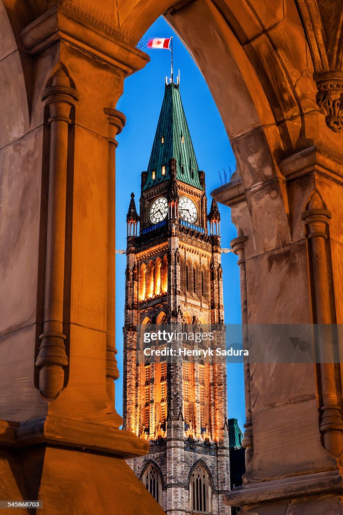Canada, Ontario, Ottawa, Parliament Hill, Illuminated Peace Tower seen through lancet arch