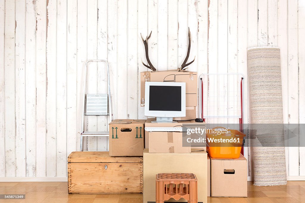 Makeshift home office with personal computer on cardboard boxes