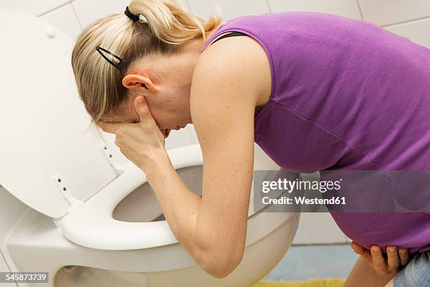 pregnant woman vomiting - vomit stock pictures, royalty-free photos & images