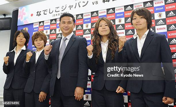 Japan - Japan coach Norio Sasaki poses with his soccer players for the fifth Women's World Cup -- Yuki Nagasato , Nahomi Kawasumi , Homare Sawa and...