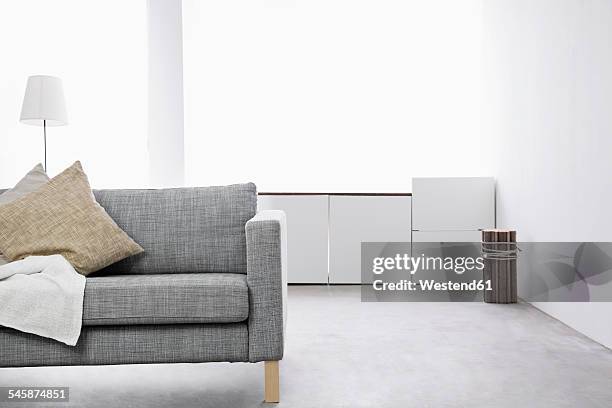 modern living room with couch and sideboard - grey sofa stock pictures, royalty-free photos & images