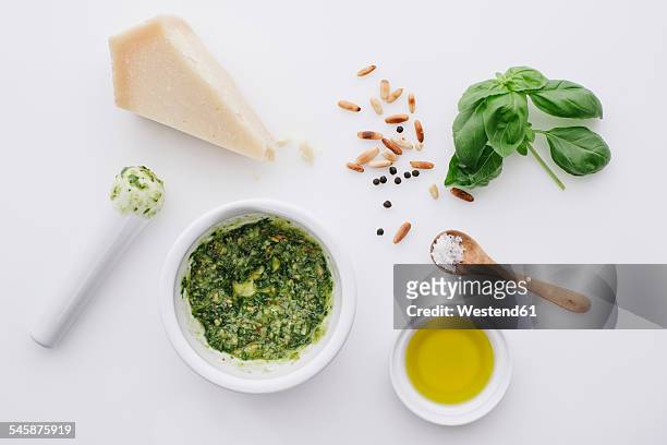 ingredients for pesto on white ground - basil stock pictures, royalty-free photos & images