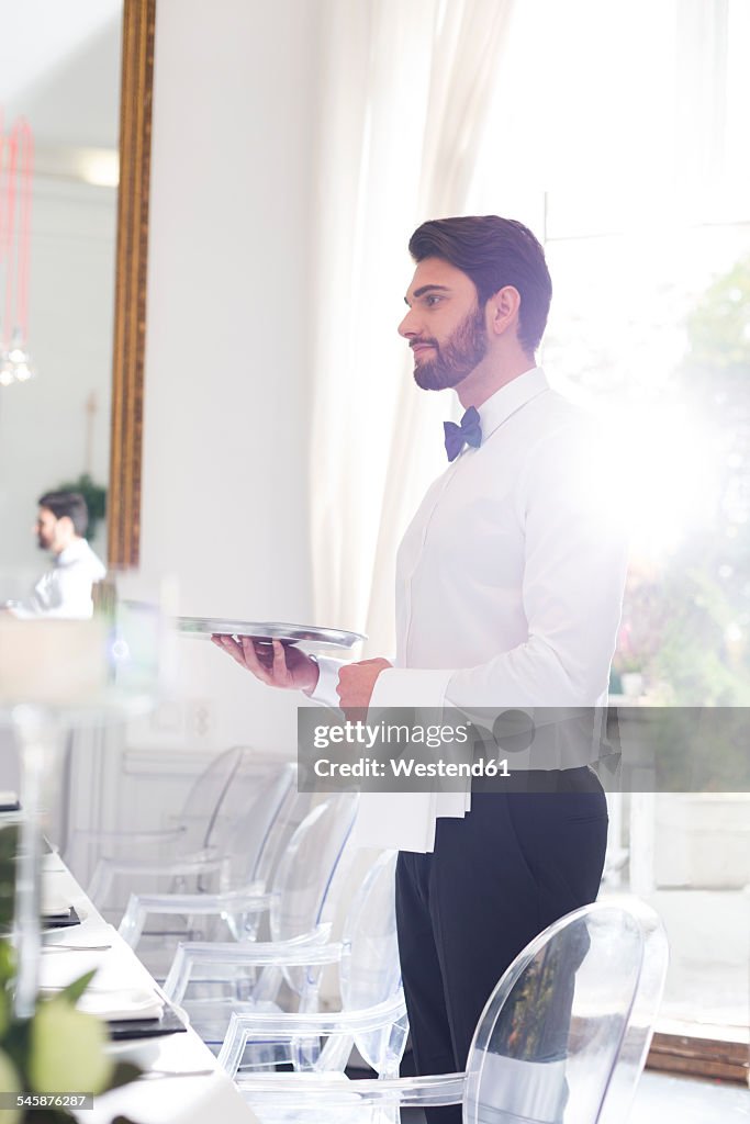Elegant waiter in restaurant