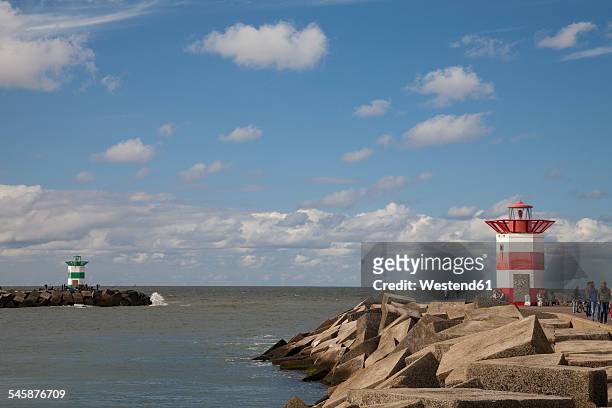 netherlands, the hague, scheveningen, port entrance and lighthouses - the hague stock pictures, royalty-free photos & images