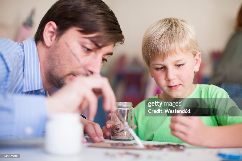 Teacher and boy in art class