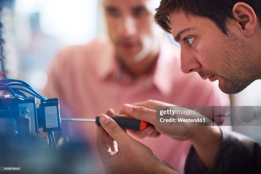 Electrician working with screw driver