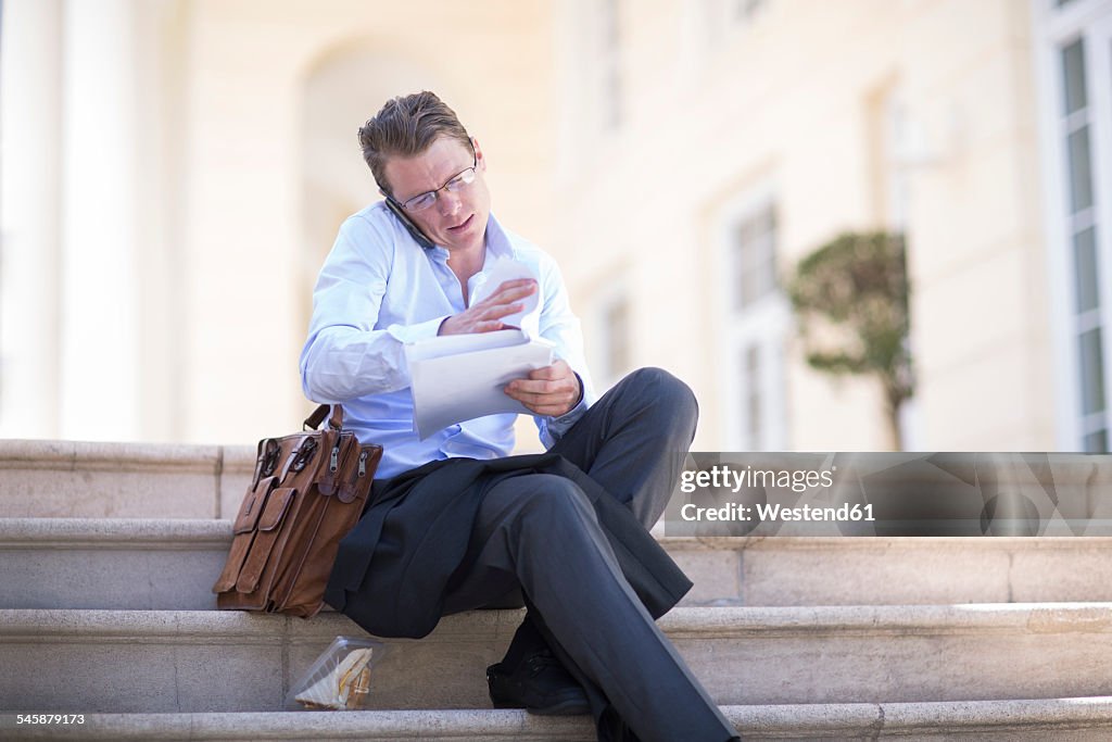 South Africa, Capetown, Businessman on the phone, outdoors