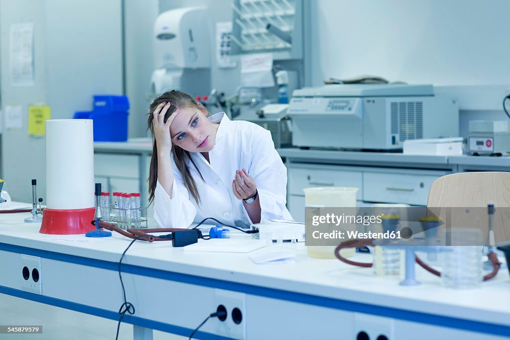 Young female natural scientist working at microbiology laboratory