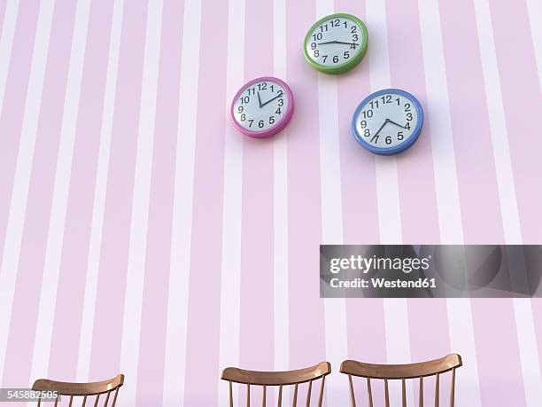 three back rests and wall clocks in front of striped wallpaper - wall clock wood stock illustrations