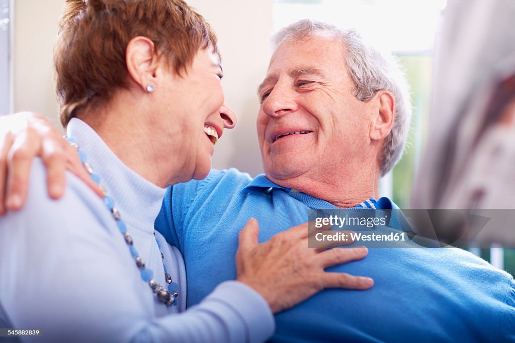 Happy senior couple embracing