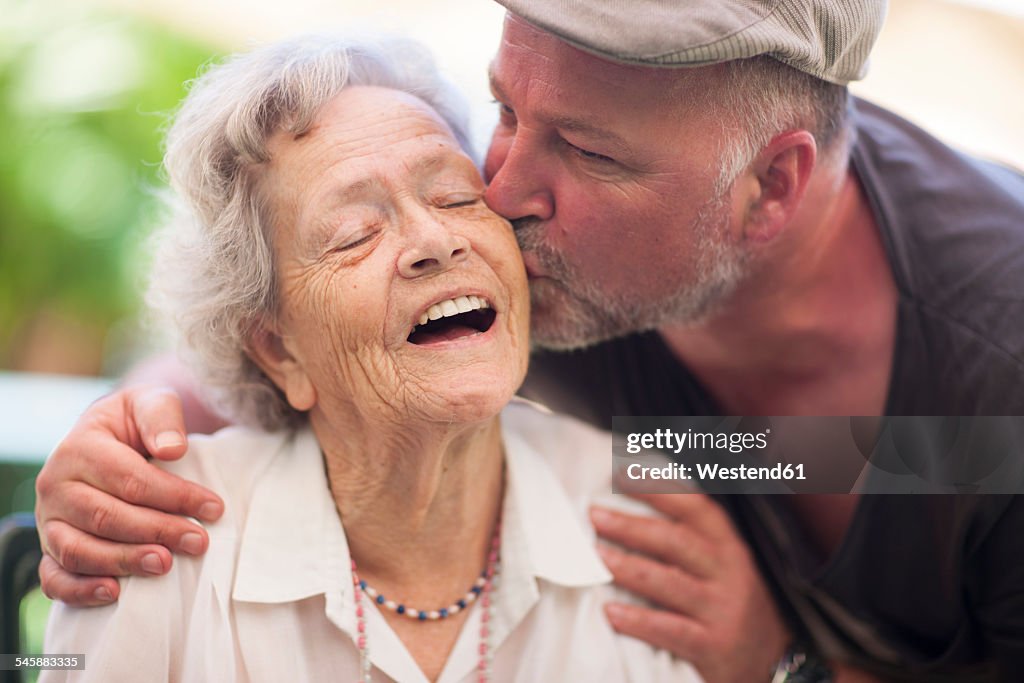 Mature man and happy senior woman outdoors