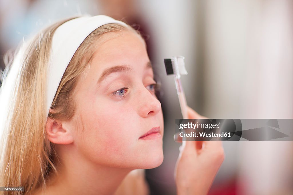 Girl on a beauty farm applying make-up