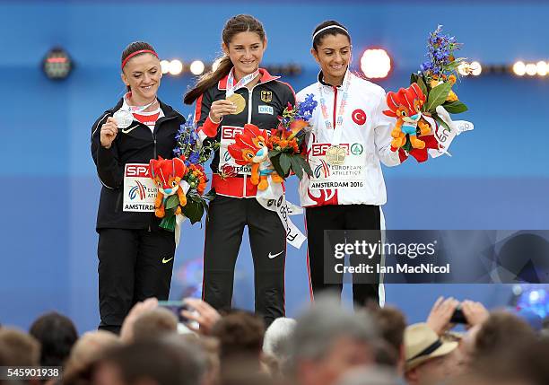 Ozlem Kaya of Turkey , Gesa-Felicitas Krause of Germany and Luiza Gega of Albania celebrate on the podium after receiving their medals from the final...