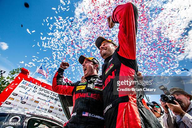 Dane Cameron, L, and Eric Curran celebrate after winning the IMSA WeatherTech Series race at Canadian Tire Motorsport Park on July 8, 2016 in...