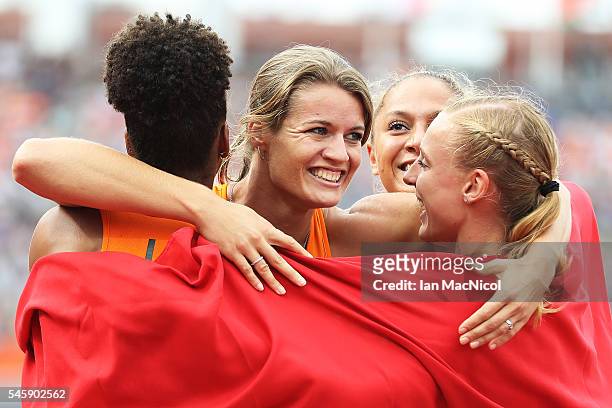 Dafne Schippers of The Netherlands celebrates with team mates after winning gold in the final of the womens 4x100m relay during day five of The...
