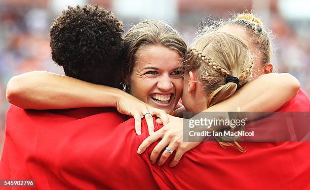 Dafne Schippers of The Netherlands celebrates with team mates after winning gold in the final of the womens 4x100m relay during day five of The...