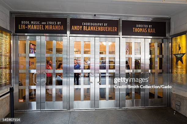 Entryway to the Richard Rodgers theatre, with signs for the musical Hamilton, New York City, New York, July 7, 2016. .