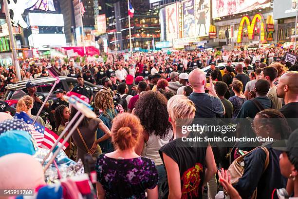 During a Black Lives Matter protest in New York City's Times Square following the shooting deaths of Alton Sterling and Philando Castile, activists...