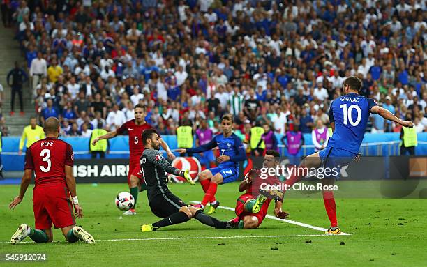 Andre-Pierre Gignac of France has a shot on goal past Rui Patricio of Portugal and Jose Fonte which hits the post during the UEFA EURO 2016 Final...