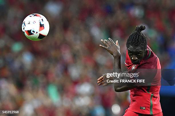 Portugal's forward Eder heads the ball during the Euro 2016 final football match between France and Portugal at the Stade de France in Saint-Denis,...