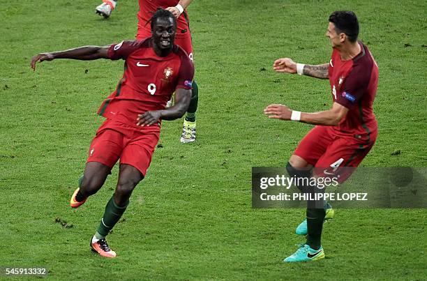 Portugal's forward Eder celebrates after scoring a goal with Portugal's defender Fonte during the Euro 2016 final football match between Portugal and...