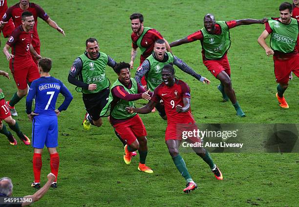 Eder of Portugal celebrates scoring the opening goal with his team mates during the UEFA EURO 2016 Final match between Portugal and France at Stade...