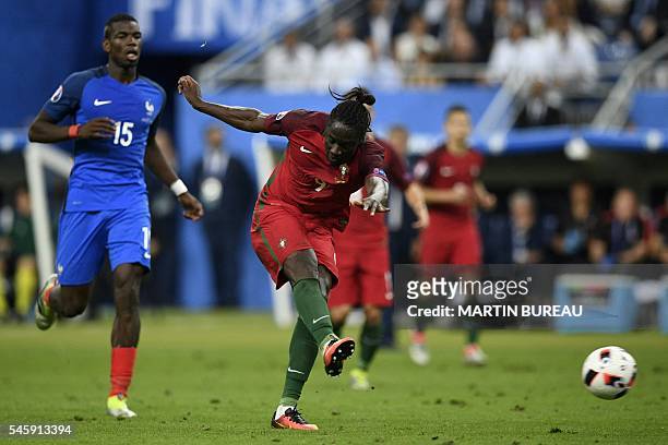Portugal's forward Eder shoots to score the team's first goal during the Euro 2016 final football match between France and Portugal at the Stade de...