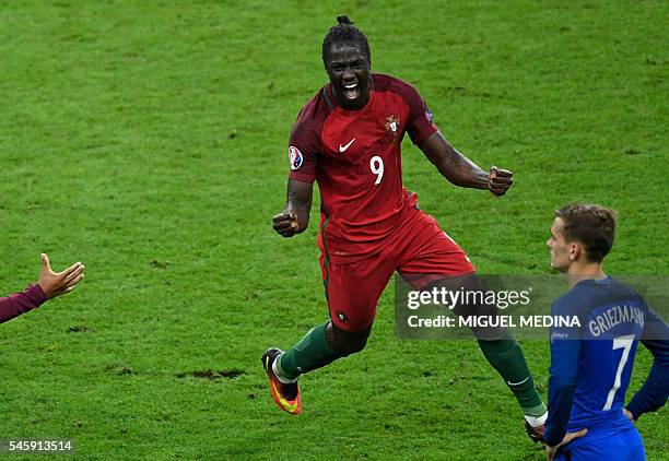 Portugal's forward Eder celebrates after scoring a goal next to France's forward Antoine Griezmann during the Euro 2016 final football match between...