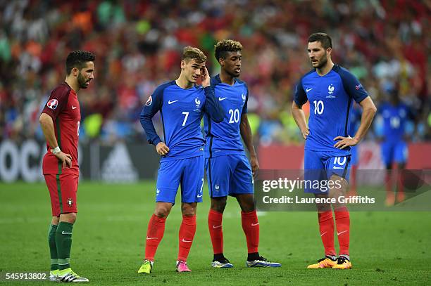 Antoine Griezmann, Kingsley Coman and Andre-Pierre Gignac of France show their dejection after Portugal's first goal during the UEFA EURO 2016 Final...