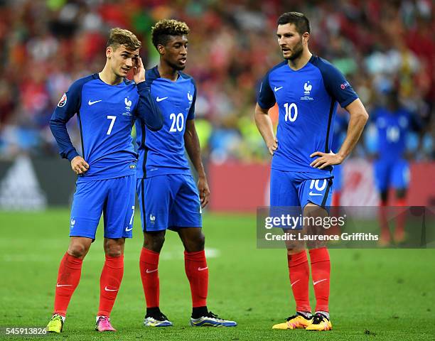 Antoine Griezmann, Kingsley Coman and Andre-Pierre Gignac of France show their dejection after Portugal's first goal during the UEFA EURO 2016 Final...