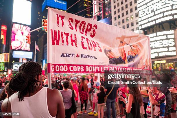 During a Black Lives Matter protest in New York City's Times Square following the shooting deaths of Alton Sterling and Philando Castile, a young...