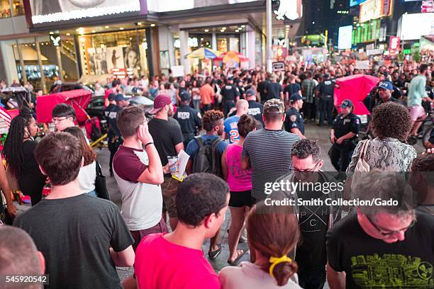 During a Black Lives Matter protest in New York City's Times Square following the shooting deaths of Alton Sterling and Philando Castile, activists...