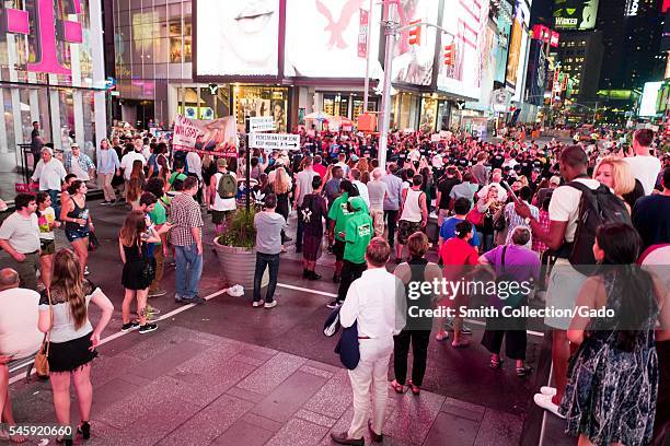 During a Black Lives Matter protest in New York City's Times Square following the shooting deaths of Alton Sterling and Philando Castile, activists...