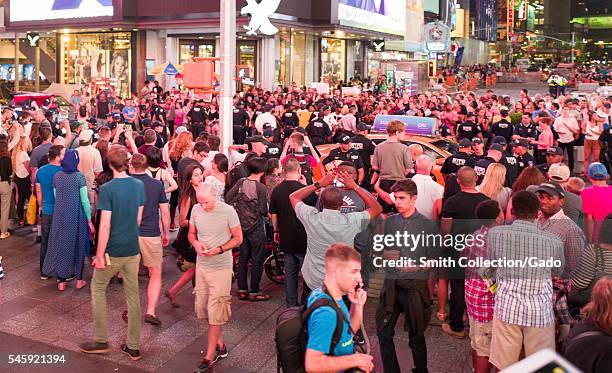 During a Black Lives Matter protest in New York City's Times Square following the shooting deaths of Alton Sterling and Philando Castile, a taxicab...