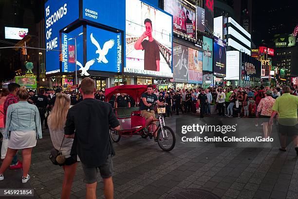 During a Black Lives Matter protest in New York City's Times Square following the shooting deaths of Alton Sterling and Philando Castile, a pedal cap...