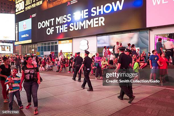 During a Black Lives Matter protest in New York City's Times Square following the shooting deaths of Alton Sterling and Philando Castile, a woman...