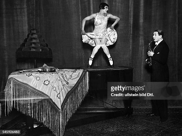 Germany Free State Prussia Berlin Berlin: Vaudeville show The dance comedians '2 Hugos' dance on a grand piano play sax in 'Universum' theater - 1929...