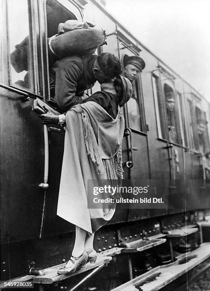 Kisses US soldier tenderly kissing his girlfriend goodbye before departing by train (from Koblenz) Kisses US soldier tenderly kissing his girlfriend goodbye before departing by train (from Koblenz)