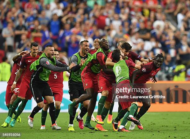 Eder of Portugal celebrates scoring the opening goal with his team mates during the UEFA EURO 2016 Final match between Portugal and France at Stade...