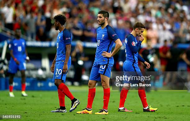 Kingsley Coman, Andre-Pierre Gignac and Antoine Griezmann of France show their dejection after Portugal's first goal during the UEFA EURO 2016 Final...