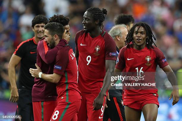 Portugal's midfielder Renato Sanches and Portugal's forward Eder celebrate after beating France during the Euro 2016 final football match at the...