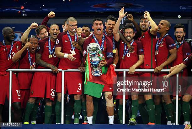 Cristiano Ronaldo of Portugal lifts the European Championship trophy after his side win 1-0 against France during the UEFA EURO 2016 Final match...