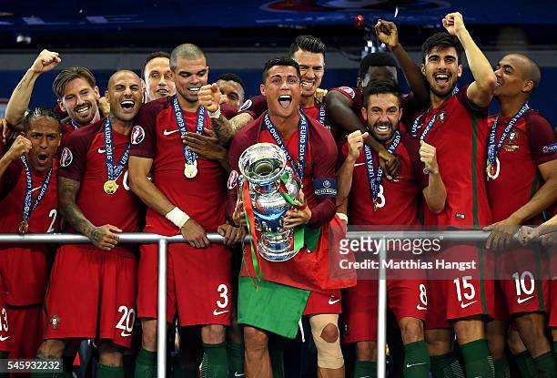 Cristiano Ronaldo of Portugal lifts the European Championship trophy after his side win 1-0 against France during the UEFA EURO 2016 Final match...