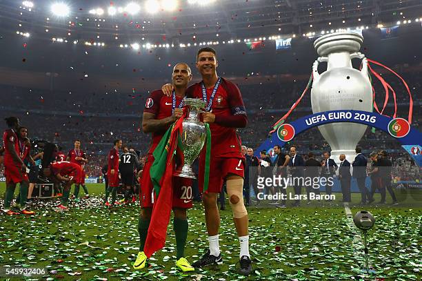 Cristiano Ronaldo and Ricardo Quaresma and Portugal hold the Henri Delaunay trophy to celebrate after their 1-0 win against France in the UEFA EURO...