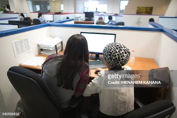 Ultra-Orthodox Jewish women work on computers at their desks in the Comax software company office in the central city of Holon near Tel Aviv on April...