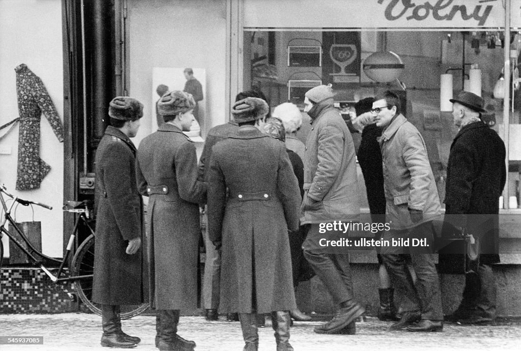 Prague Spring - Suppression Invasion of Czechoslovakia by troops of the Warsaw Pact countries| Soviet soldiers before a radio shop in Mlada Boleslav - 1968