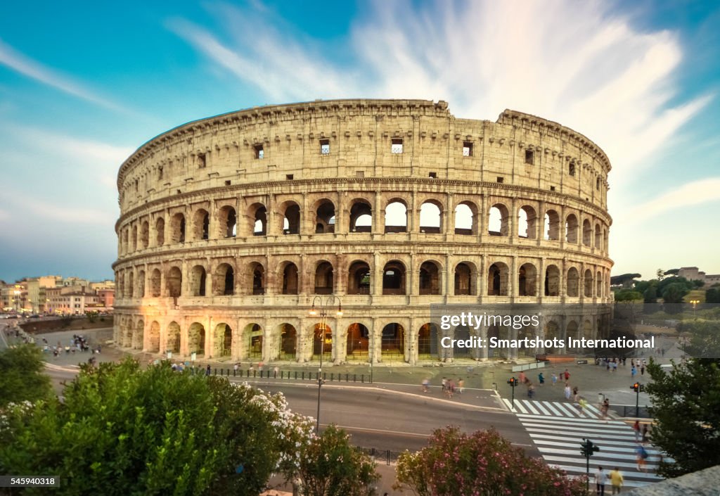 Roman Colosseum (Flavian Amphitheater) with dramatic sky at sunset, Rome, Italy