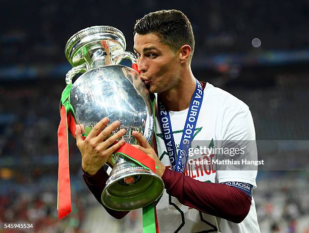 Cristiano Ronaldo of Portugal kisses the Henri Delaunay trophy to celebrate after their 1-0 win against France in the UEFA EURO 2016 Final match...