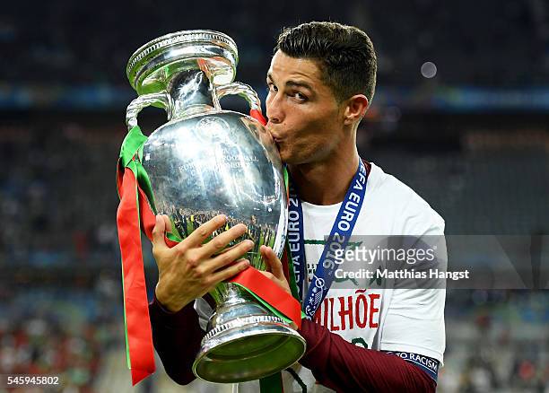 Cristiano Ronaldo of Portugal kisses the Henri Delaunay trophy to celebrate after their 1-0 win against France in the UEFA EURO 2016 Final match...