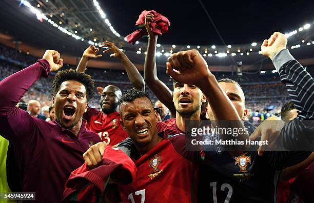 Nani and Portugal players celebrate after their team's 1-0 win against France in the UEFA EURO 2016 Final match between Portugal and France at Stade...